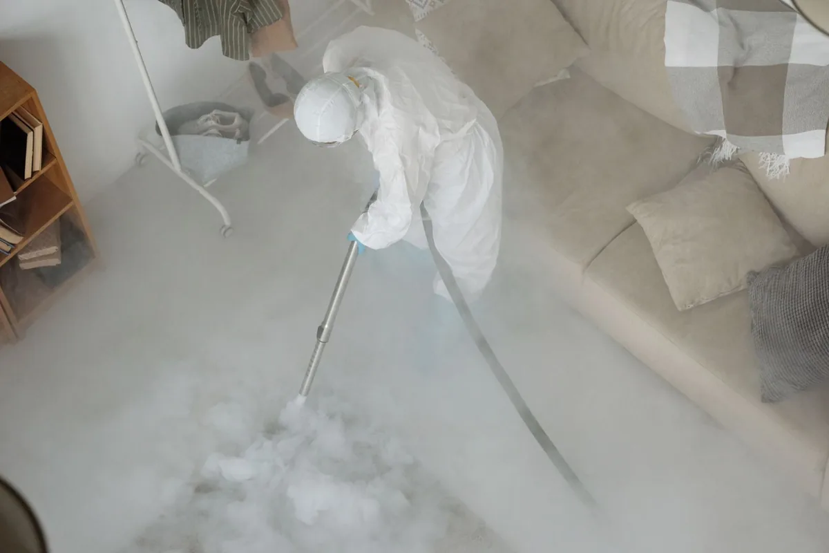 Biohazard cleanup technician in protective equipment, Clarendon, TX